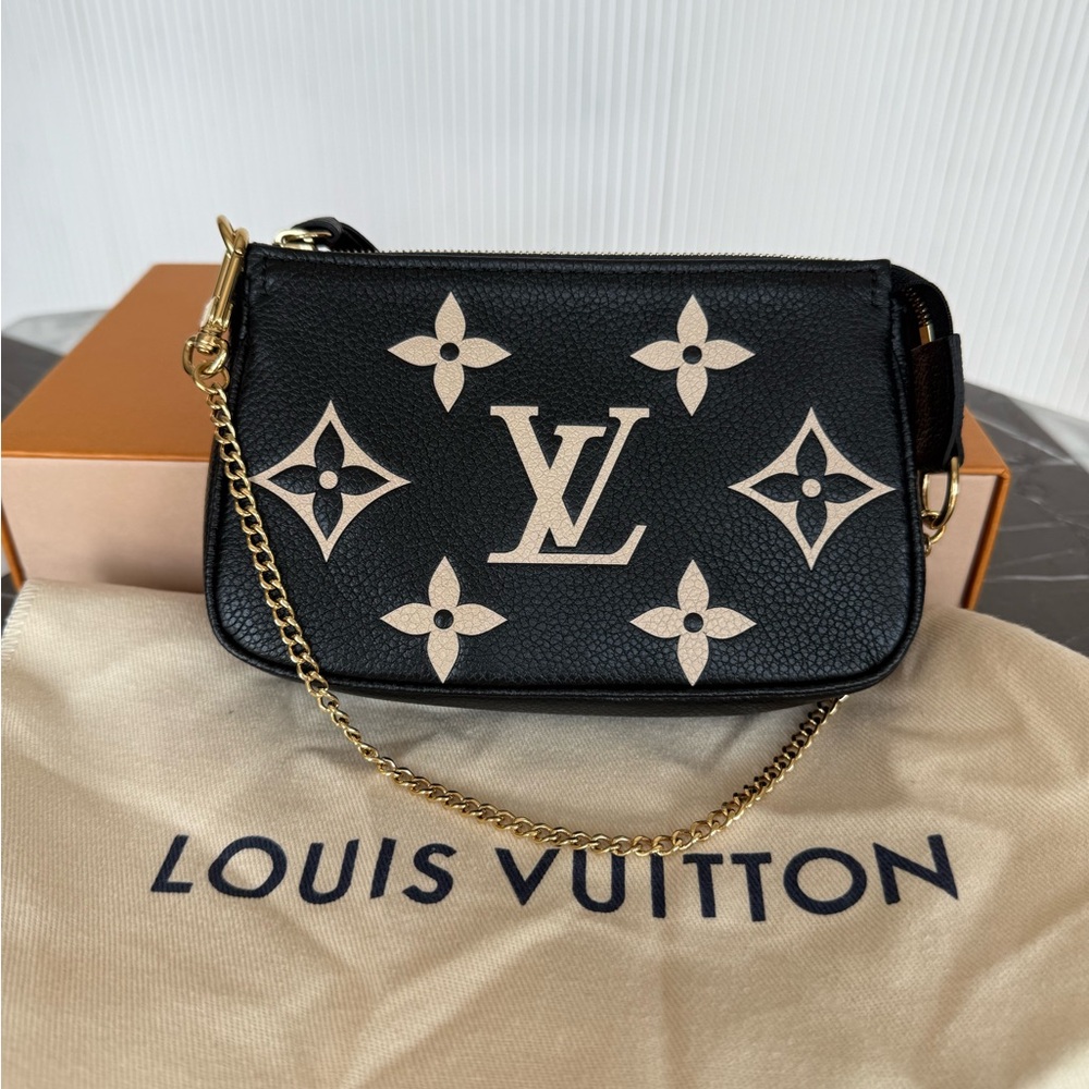Authenticated Louis Vuitton Pochette Monogram Empreinte Giant Mini Bag
